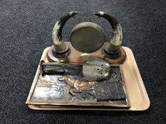 A tray of embossed panel depicting a pointer,