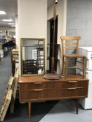 A teak four drawer chest, a teak standard lamp,