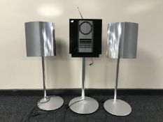 A Bang & Olufsen Beosound 3000 CD player on stand and a pair of speakers on stands