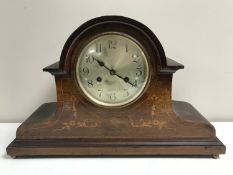 An inlaid mahogany 8 day mantel clock with silvered dial