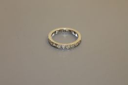 A platinum and diamond eternity ring CONDITION REPORT: The ring is size N/O.