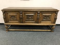 A continental oak triple door low sideboard, width 181 cm.
