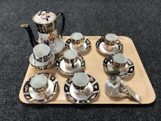 A tray of fifteen pieces of antique gilded tea china,