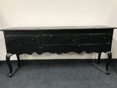 A painted dresser base fitted three drawers