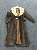 A mid twentieth century fur lined brown suede lady's coat.