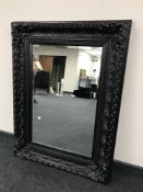 A Victorian style black framed mirror