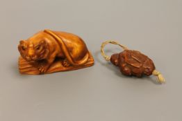 A Japanese carved wood netsuke of a tiger,