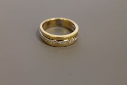 An 18ct gold diamond half eternity ring, size M/N.