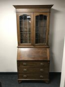 An Edwardian oak bureau bookcase