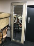 A silvered framed cushion hall mirror