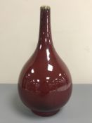 A Chinese Sang de Boeuf bottle vase, with blue six character mark to base, height 35 cm.
