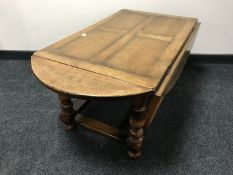 A Chapman's Siesta oak drop leaf table