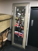 A silvered framed cushion hall mirror