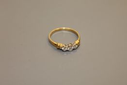 An 18ct gold three stone diamond ring, total diamond weight estimated at 0.