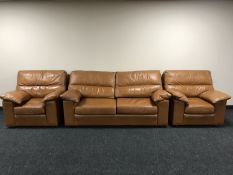 A late 20th century three piece tan leather lounge suite
