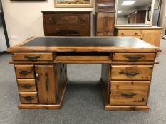 A plantation pine double pedestal desk, width 165 cm.