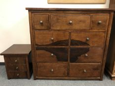 A contemporary mahogany nine drawer block chest,