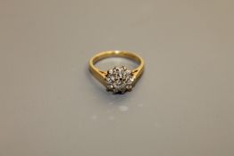 An 18ct gold diamond cluster ring,