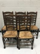 A set of five ladder backed country kitchen chairs