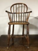 A 19th century elm child's Windsor chair, height 80 cm.