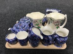 A tray of ten pieces of Ringtons chintz china and a pair of Maling lustre jugs