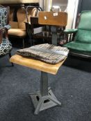 A mid 20th century Singer machinist's chair CONDITION REPORT: This chair has a