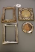 Four antique silver photograph frames.