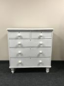 An antique pine five drawer chest with knob handles