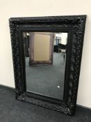 A Victorian style black framed mirror