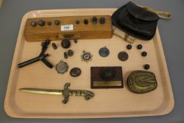 Militaria : A collection of antique lead shot, 19th century leather powder satchel,