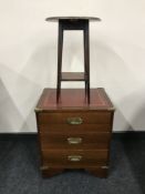 A mahogany leather topped ship's style chest and an occasional table