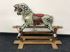 A wooden rocking horse CONDITION REPORT: Length 108cm.