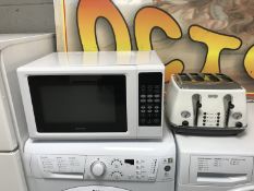 A Kenwood microwave and a Delongi four slot toaster