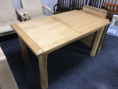 A contemporary oak dining table