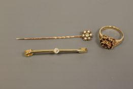 An 18ct gold bar brooch set with an old cut diamond,