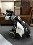 An electric Power Caddy golf cart with battery and charger,