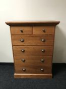 A contemporary six drawer chest