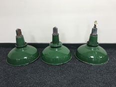 Three mid-20th century enamelled industrial light fittings