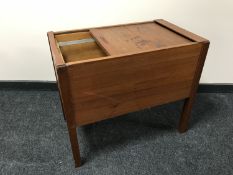 A mid 20th century teak shutter topped filing chest
