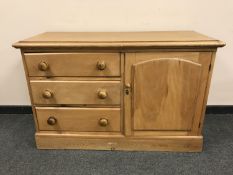 A Victorian style pine low chest fitted with a cupboard, width 120 cm.