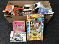 A box of boxed Robot radio, vintage Speed Flippers pin ball game, Matchbox modelling kit,