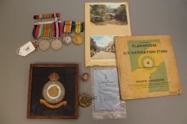 A First and Second World War medal group comprising WWI British War medal and Victory medal (both