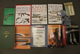 A box containing a good collection of militaria reference books; History of Colt Firearms,