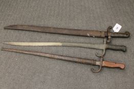 Three various bayonets including a French Chassepot in scabbard