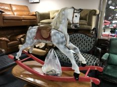 A mid 20th century wooden painted rocking horse, by Honeycombe Horses, height 98 cm.