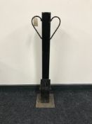 A metal driveway security post