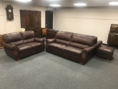 A brown leather five piece lounger suite : pair of three seater settees, two seater settee,