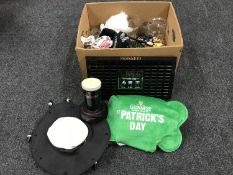 A box of Guinness pub merchandise - hat, glasses,