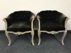 A pair of wood framed button backed dressing table chairs