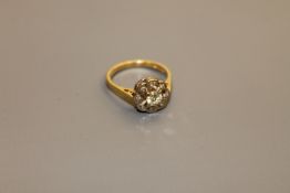 An 18ct gold diamond cluster ring, the central stone estimated at 0.